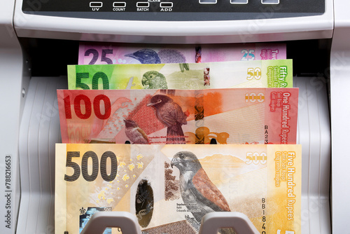 Seychellois rupee in a counting machine photo