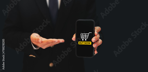 Buy Now Button on the mobile screen, online shopping concept background image with copyspace. Ecommerce buying from mobile backdrop