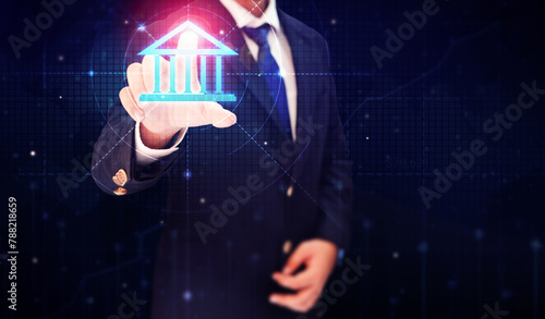 Online banking concept background, man touching the bank building with glowing shapes and backdrop.