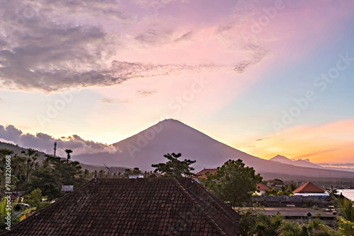 Breathtaking sunset view on Agung volcano from Amed beach in Bali, Indonesia photo