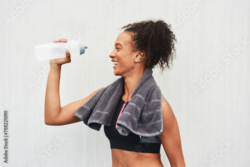 Black woman, athlete and drinking water in studio, training and hydration after workout on white background. Female person, profile and liquid for recovery after exercise, fitness and mockup space