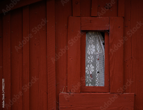 Window on red wooden barn