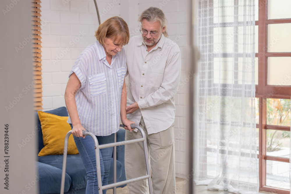 Senior Couple Supporting Each Other With Walking Aids Indoors During Daytime Senior Couple Supporting Each Other With Walking Aids Indoors During Daytime