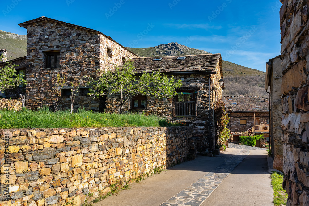 Picturesque streets with stone houses next to the mountains in Guadalajara, Valverde. - obrazy, fototapety, plakaty 