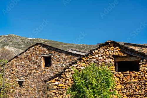 Stone houses with black slate roofs in the northern highlands of Guadalajara, Valverde