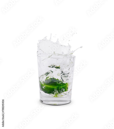 Fresh splash with lime in glass of water