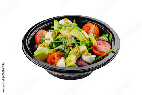 Fresh avocado salad in a black bowl
