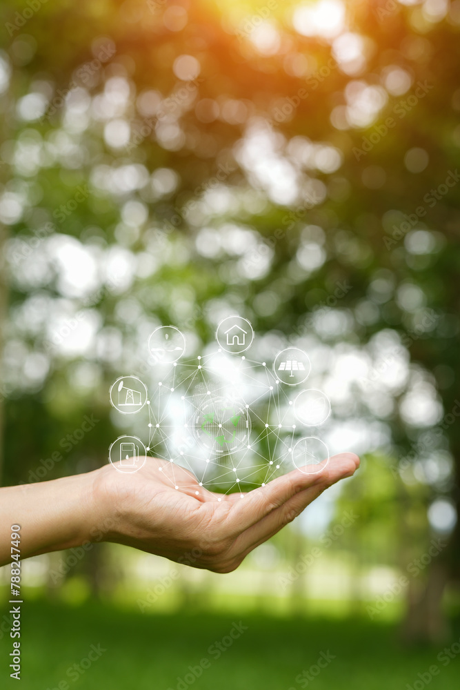 Technology, hand holding with environment Icons over the Network connection on green background. Technology, hand holding with environment Icons over the Network connection on green background.