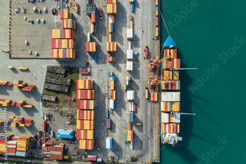 Aerial view of cargo port with container terminal at dock. International freight logistics and trade commerce transportation. © DedMityay