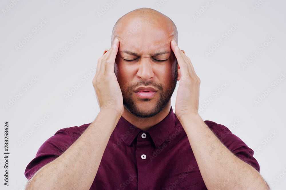 Man, headache and temple pressure in studio with vertigo tension or hand massage, fatigue or white background. Male person, stress and burnout for overworked pain with migraine, hurt or mockup space Man, headache and temple pressure in studio with vertigo tension or hand massage, fatigue or white background. Male person, stress and burnout for overworked pain with migraine, hurt or mockup space