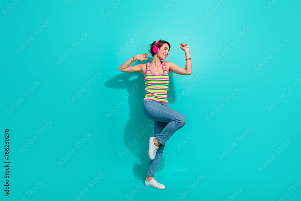 Full body portrait of pretty positive lady listen favorite playlist dancing chilling isolated on turquoise color background