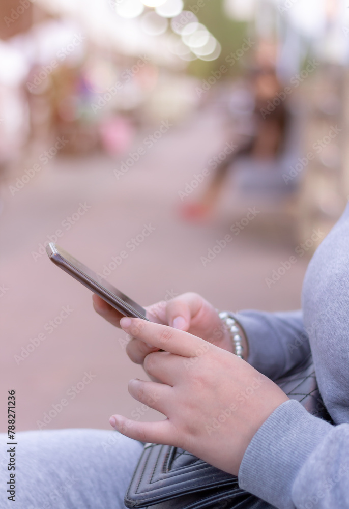 Women using smart phone mobile on soft blurred