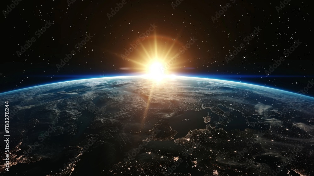 Obraz premium Sunrise over earth as seen from space. With stars background