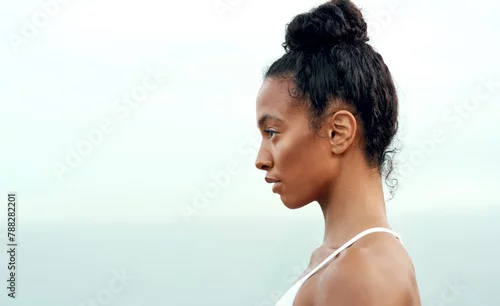 Obraz Profile, fitness and woman at beach for cardio exercise, outdoor training or wellness. Mockup, serious athlete and female person for workout goal, healthy mindset or performance in San Francisco