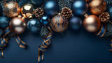 New Year minimalistic background. Golden and blue Glass Balls hanging on ribbon on a Navy blue background.