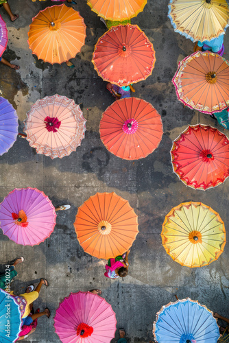 Vertical Cambodia party with coloufull umbrellas and a lot of textures.   Top view.