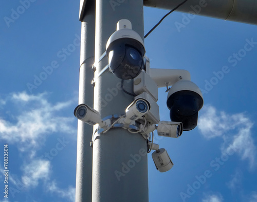 Close-up Of Security Cameras On The Street. Control and monitoring system. Metal Pole. Blue Sky. Ust-Kamenogorsk (kazakhstan)