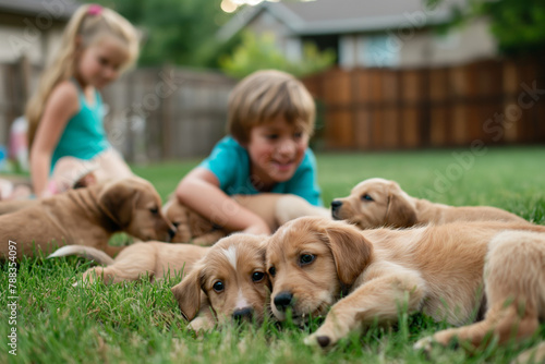 Heartwarming scene of children playing with a litter of cute puppies on a grassy backyard