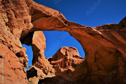 View of Double Arch - a close-set pair of natural arches in Arches National Park  it was formed as a pothole arch by water erosion from above  southern Grand County  Utah  United States 