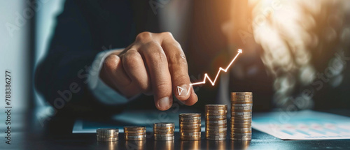 Buisnessman with coin stacking up, maoney growth, succesful investment photo