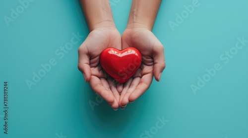 Embracing Love  Hands Clutching a Red Heart on Blue