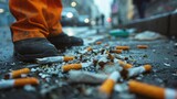 close-up of a worker's hand picking up trash and cigarette butts from the curb, taking pride in keeping streets clean and free of litter.