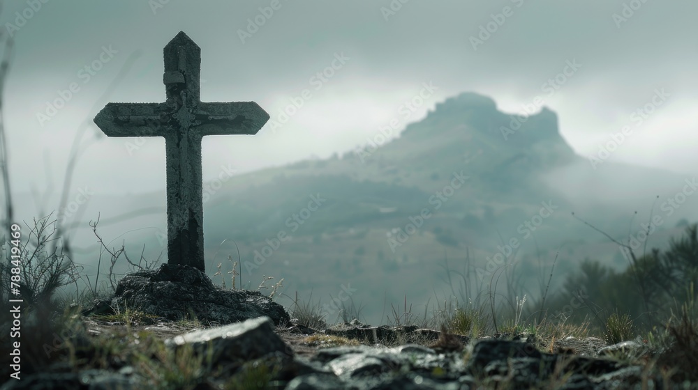 Lonely cross with mountains in the background