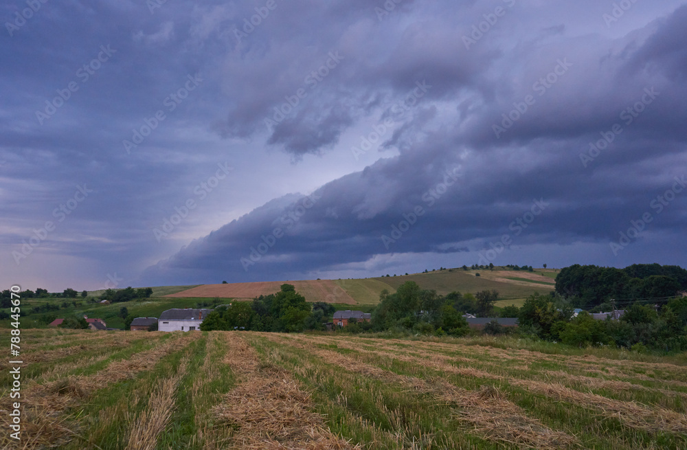 storm clouds over the village, a storm is approaching in the village, black storm clouds over the mountain storm clouds over the village, a storm is approaching in the village, black storm clouds over the mountain