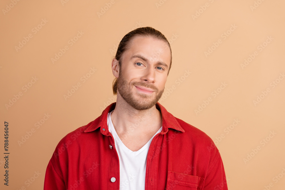 Portrait of nice young man wear red shirt isolated on beige color background - obrazy, fototapety, plakaty 