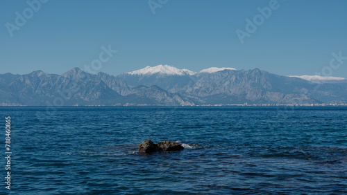 beautiful seascape and snowy mountains