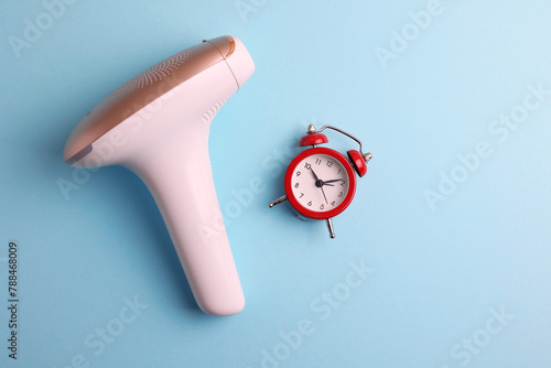 Modern home photoepilator on a colored background. Remove unwanted hair. 