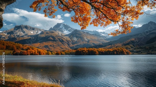 beautiful landscape of a large lake with mountains and orange trees in autumn in high resolution and quality