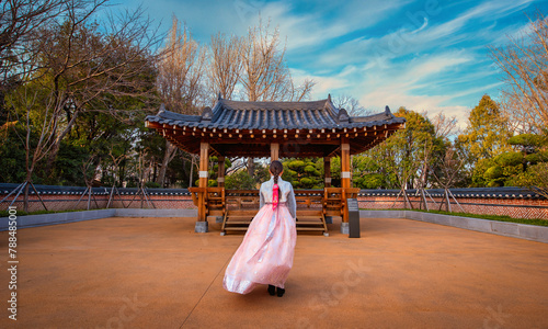 Asian korean Girls dressed Hanbok in traditional dress at sunset in South Korea.
