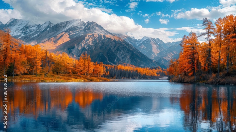 landscape of a lake with large mountains and trees in autumn