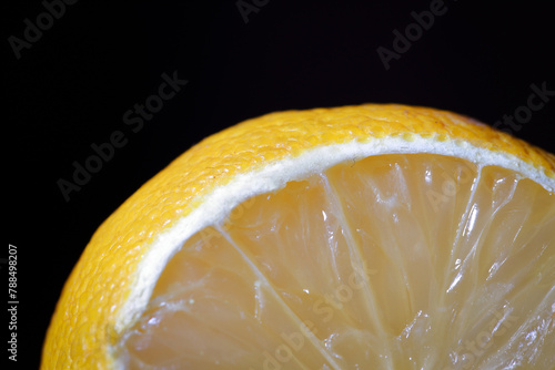 sliced lemon on a black background