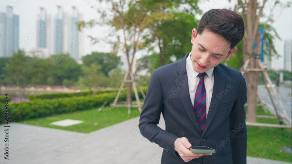 Young smart white businessman in suits and tie using smartphone, expressing disappointed face scroll down phone, sending text messages, bankrupt situation, got fired from company, unpleasant feeling Young smart white businessman in suits and tie using smartphone, expressing disappointed face scroll down phone, sending text messages, bankrupt situation, got fired from company, unpleasant feeling