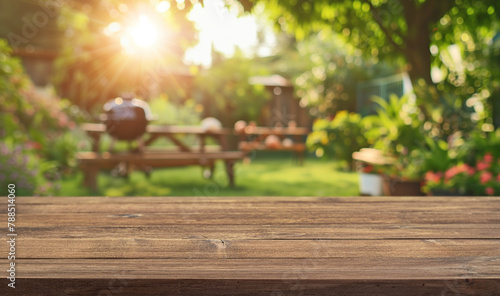 summer time party in backyard garden with grill BBQ, wooden table, blurred background © andreusK