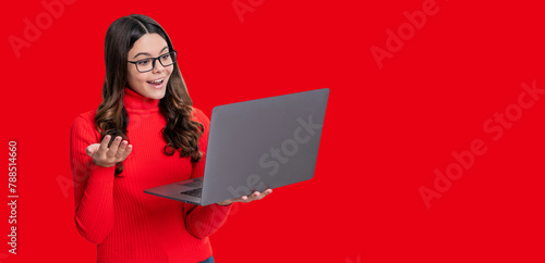 Teen girl study online. Online education. Back to school. Knowledge and online education. Video lesson on laptop. Copy space banner. Teen girl with laptop isolated on red. Remote education © be free