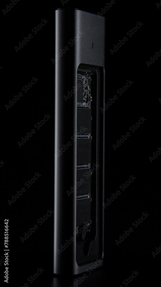Open SSD Case with inside High-Speed M.2 on black background, External USB Drive. High quality photo Open SSD Case with inside High-Speed M.2 on black background, External USB Drive. High quality photo