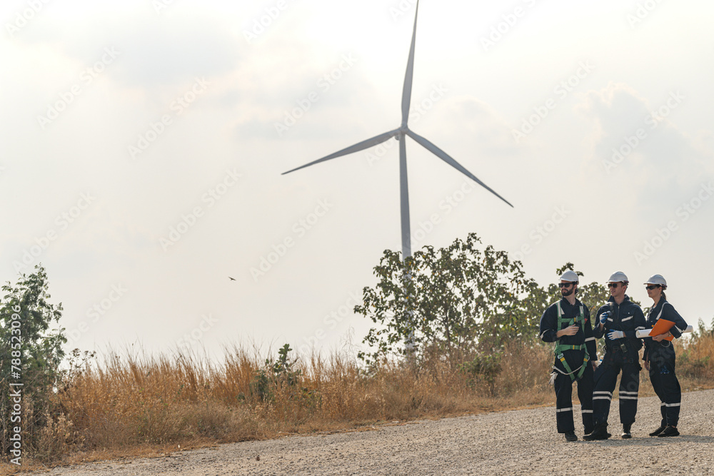 custom made wallpaper toronto digitalEngineers man and woman inspecting construction of WIND TURBINE FARM. WIND TURBINE with an energy storage system operated by Super Energy Corporation. Workers Meeting to check AROUND THE AREA.
