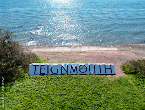 Teignmouth, South Devon, England: DRONE VIEWS: A place name sign on the seafront spells out 