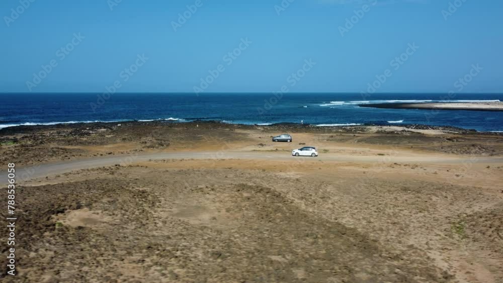 Foto aérea del faro de Sardina, Gran Canaria, Islas Canarias. Dron.WINDING MOUNTAIN ROAD WITH LAKE FROM AERIAL VIEW WITH DRONE Foto aérea del faro de Sardina, Gran Canaria, Islas Canarias. Dron.WINDING MOUNTAIN ROAD WITH LAKE FROM AERIAL VIEW WITH DRONE