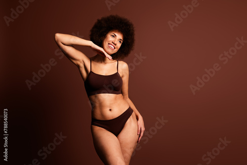 Photo of dreamy adorable lady underwear lingerie enjoying beautiful body looking emtpy space isolated brown color background © deagreez