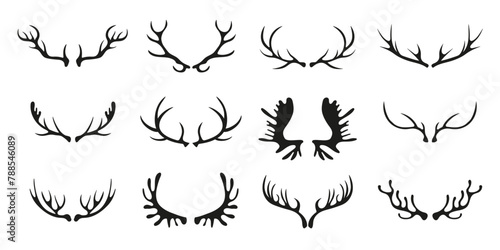Black silhouettes of different deer horns on white. Deer antlers. Collection of vector elements on the theme of of hunting, tourism and environment.