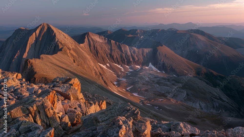 Majestic Sunset Over Rugged Mountain Peaks and Valleys