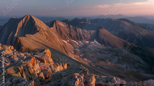 Majestic Sunset Over Rugged Mountain Peaks and Valleys