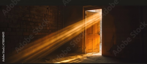 Sunlight creates a pattern of light when it filters through an open door.