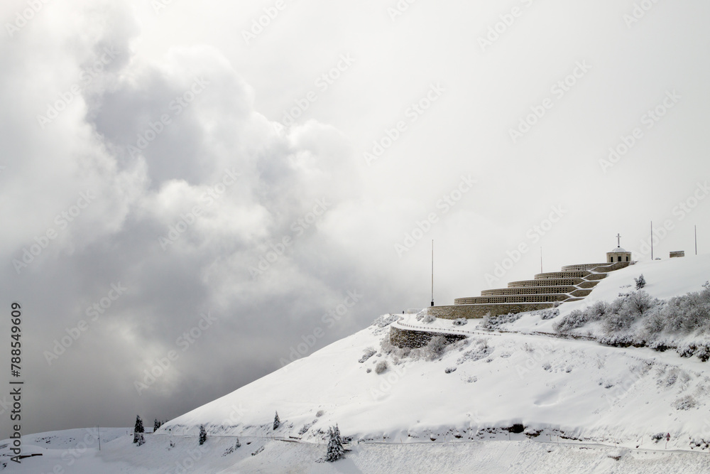 Mountain winter landscape. Mount Grappa war memorial building view