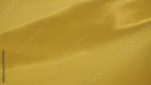 Dark yellow silk fabric background  photo