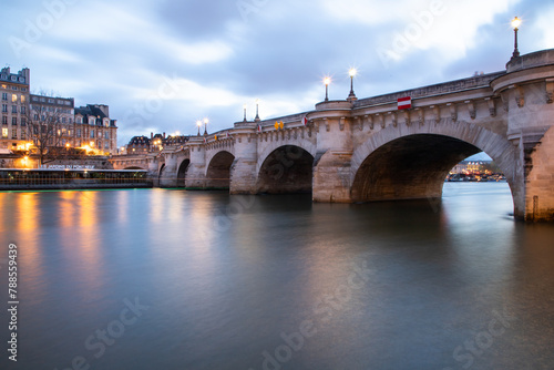 bridge Pont Neuf and Seine river with old houses, Paris, France, toned